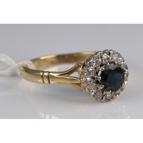 174 - An 18ct gold sapphire and diamond floral ring