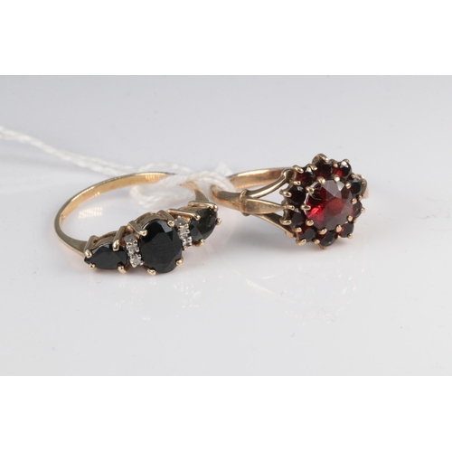 177 - 9ct gold dress ring set with garnets together with another 9ct gold sapphire and moissanite ring (ap... 