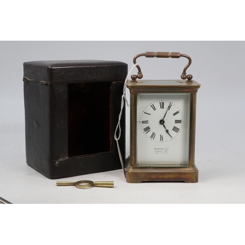 34 - Harrods brass carriage clock in travel case and key.