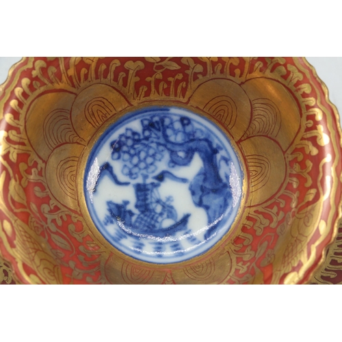 39 - Impressive Chinese tea bowl and matching saucer. Red ground with gilt borders and with Blue and whit... 