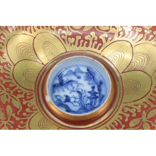 39 - Impressive Chinese tea bowl and matching saucer. Red ground with gilt borders and with Blue and whit... 