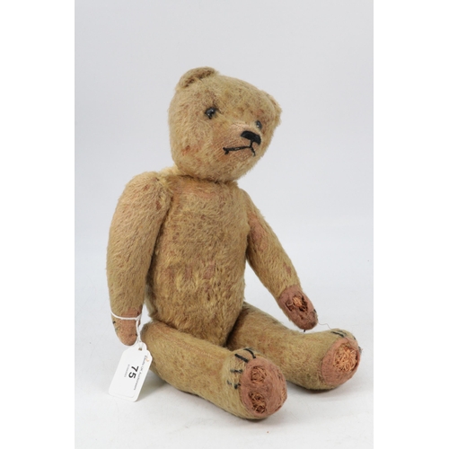 75 - Antique well loved jointed and straw filled teddy bear