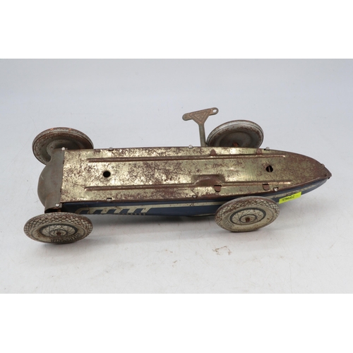 A vintage tin plate clockwork racing car
