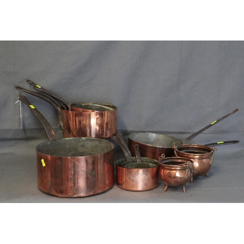 352 - Set of French copper and cast handled saucepans.