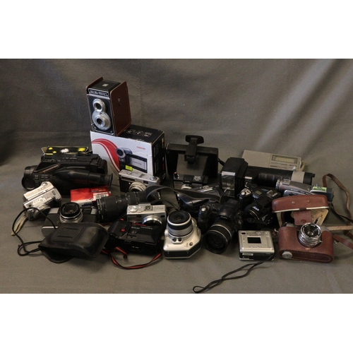 436 - A large assortment of vintage cameras, video cameras etc all deemed spares/repairs