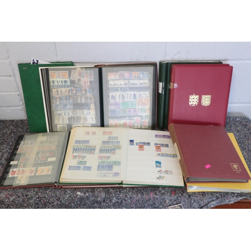 551 - Four stamp stock albums containing Channel Islands and Isle of Man stamps together with three hardbo... 