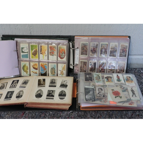 554 - Three albums of cigarette cards together with an Ogdens album.