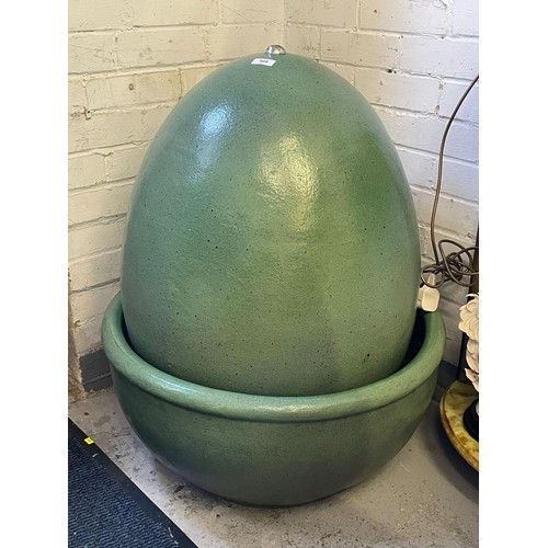 468 - Ceramic garden water feature in the form of a large egg in bowl (overall height approx. 80cm tall)