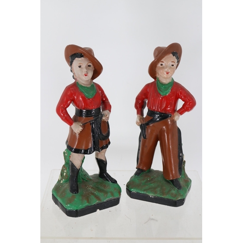 21 - Pair of plaster cowboy and cowgirl measures 33cm tall