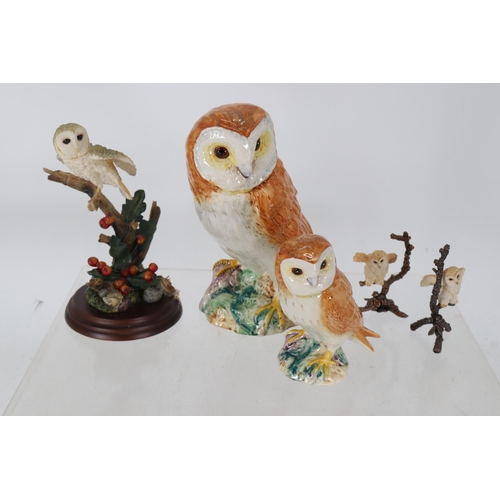 22 - Beswick owls together with some other owl models.  Beswick owls measuring approx. 19cm and 12cm