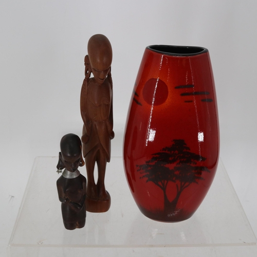 25 - Poole African Sky vase and two ethnic carved figures.