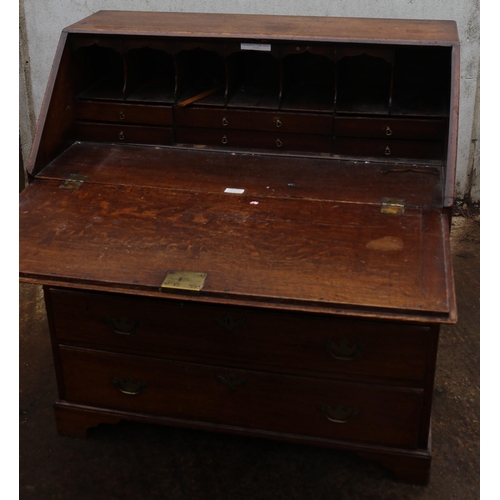 160 - Oak bureau with key and brass fittings measures approx. 95cm w x 51cm d x 104cm