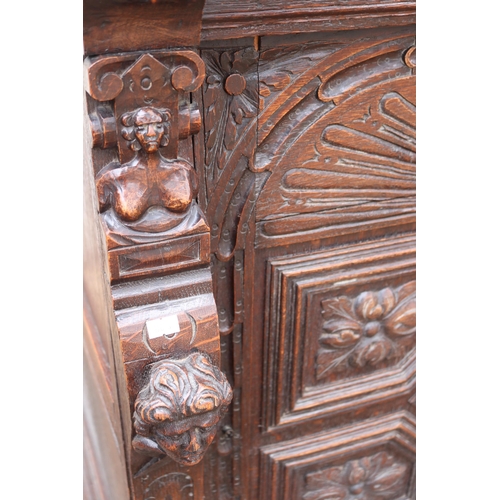 218 - Vitruvian carved cabinet with drop away drop drawer and heavily carved door to cabinet (inspect) mea... 