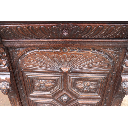 218 - Vitruvian carved cabinet with drop away drop drawer and heavily carved door to cabinet (inspect) mea... 