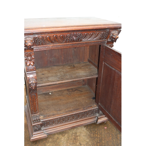 218 - Vitruvian carved cabinet with drop away drop drawer and heavily carved door to cabinet (inspect) mea... 