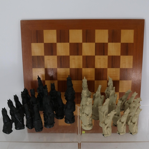 342 - Large resin chess set on board