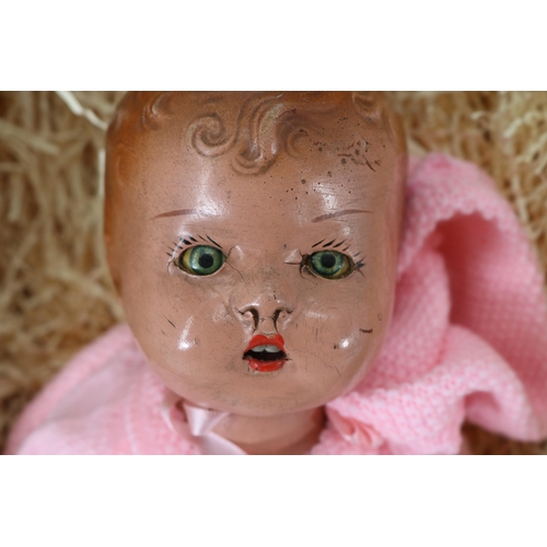 348 - 13'' pottery doll with closing and painted eyes