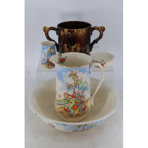 359 - Treacle glaze antique two handled cup with hidden frogs inside (crack to base) together with a spode... 