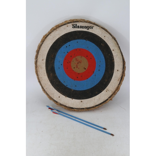 370 - Slazenger straw archery target with two arrows