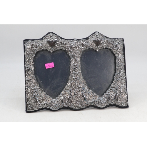 15 - Silver hallmarked twin heart shaped, dual silver fronted photo frame measures approx.  25.5cm wide b... 