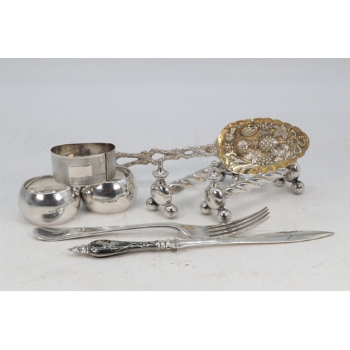 27 - Three silver hallmarked napkin rings (one a/f), together with a silver fork and spoon with matching ... 