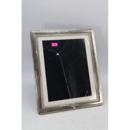 28 - A 925 silver hallmarked photo frame, measures approx. 29.5cm x 24.5cm overall