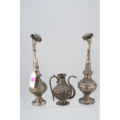 51 - Eastern white metal? plated? Rosewater vessels, measure approx. 21cm high together with a similar ke... 