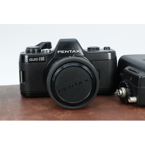 84 - Pentax Auto 110, with lens and flash in case.