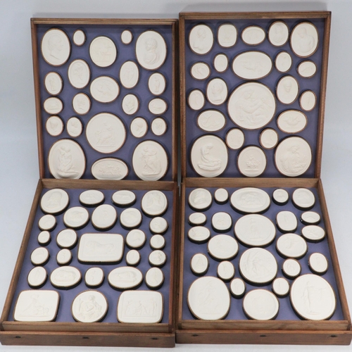 88 - Vintage series of Grand Tour Intaglio plaster seals in four oak stacking trays.