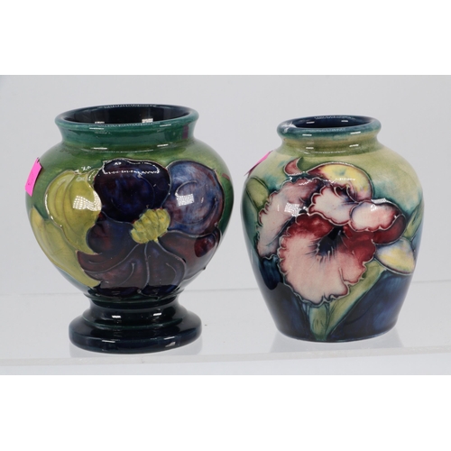 99 - Two Moorcroft vases to include Clematis design approx. 6cm high together with  Orchid Vase approx. 8... 