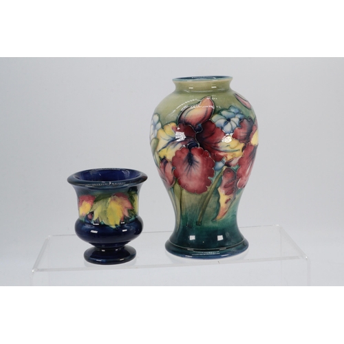 103 - Moorcroft Vase in the spring flowers design, approx, 15cm high together with  7cm Vase in Leaf and B... 