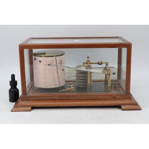 146 - A cased Barograph with three packs of paper.