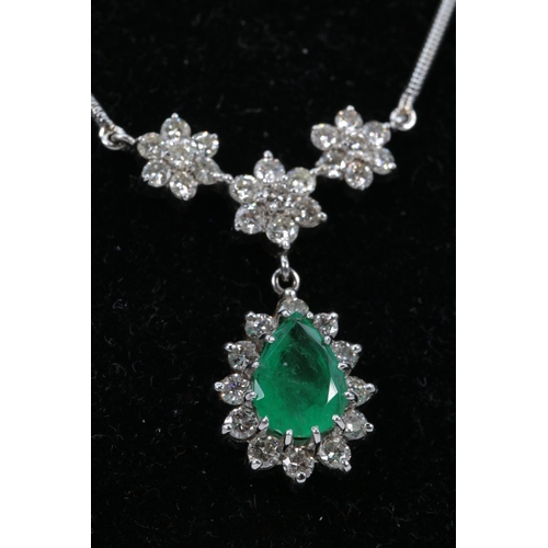 182 - An 18ct white gold necklace with attached pendant comprising of Emerald Teardrop surrounded by diamo... 