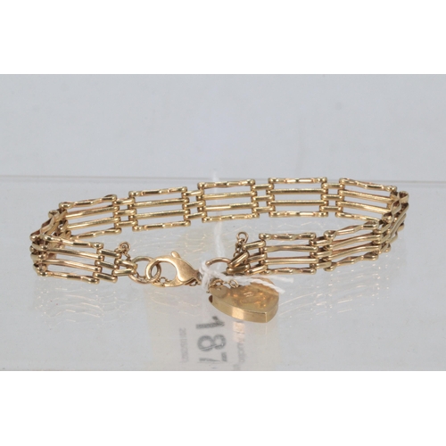 187 - A 9ct gold gate link bracelet with heart padlock and safety chain (approx. weight 12g)