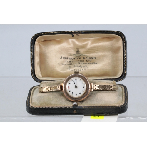 192 - A 9ct gold cased watch with 9ct gold strap, Talis Swiss movement (approx. overall weight 24g)