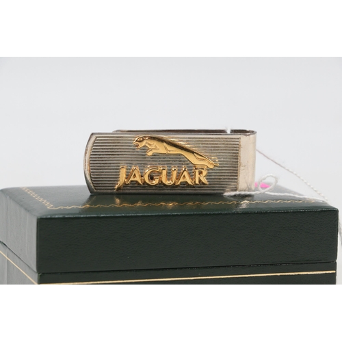 20 - Boxed jaguar clip, hallmarked silver to reverse with silver gilt applied jaguar logo