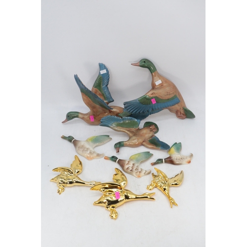 Three Keele Street Pottery flying wall ducks, together with a modern
