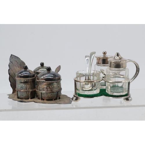 47 - A silver plated small cruet set together with a white metal Eastern similar