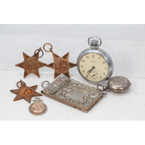 76 - Two 1939-45 WWII stars, an Italy star, together with a plated notebook, Ingersoll pocket watch etc