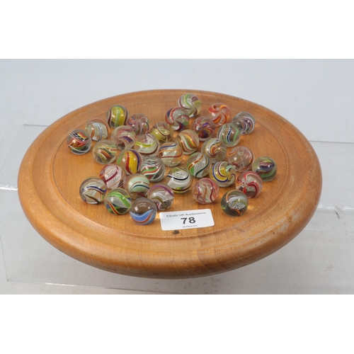 78 - Selection of antique twist marbles with a later solitaire board