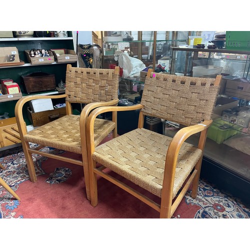 326 - A pair of vintage elbow chairs with rush covered seats and back