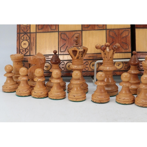 463 - A folding wooden chess board complete with pieces