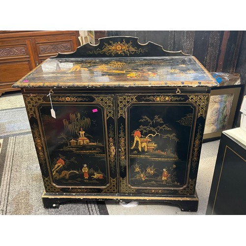 466 - Vintage oriental chinoiserie lacquered cupboard with raised back and a pull out writing shelf, showi... 