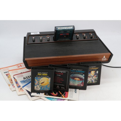 650 - Atari video computer system with 6 cartridges/games and some instructions etc