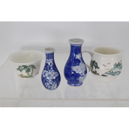 6 - Prunus vases measuring approx. 9cm and 10cm with two other ceramic items. No chips or flaws noted