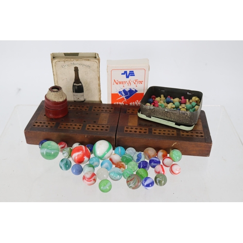 40 - Cribbage board together with a vintage promotional pack of Dry Monopol and a selection of marbles et... 