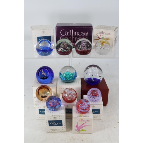 87 - Eleven Caithness paperweights, boxed - one of which contains two weights, and one unbranded paperwei... 