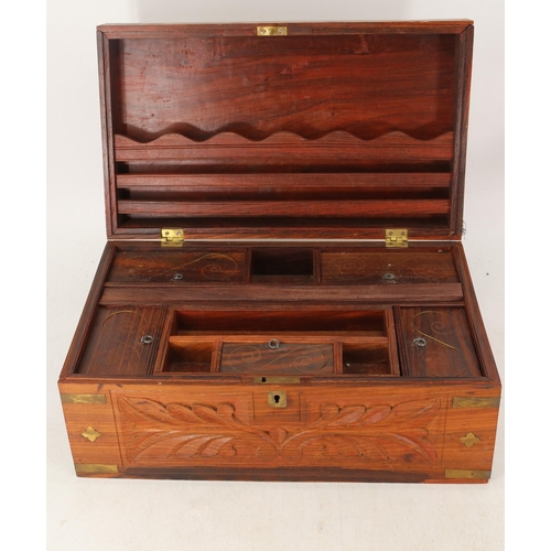 141 - A hardwood writing box with brass inlay.