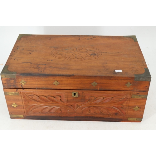 141 - A hardwood writing box with brass inlay.