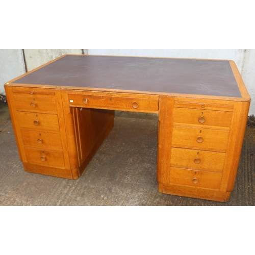 143 - Utility era/art deco office desk with nine drawers to the front with two sliding rests with two cupb... 